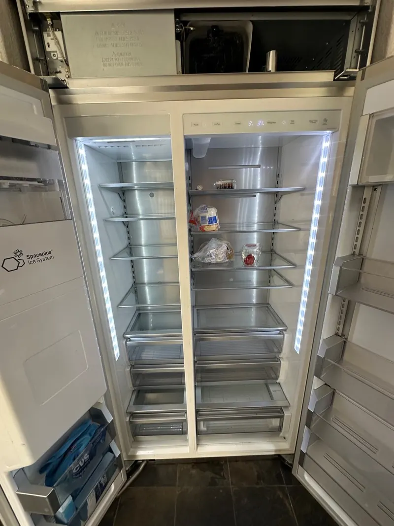 Built-in refrigerator open during a cooling system check on a Pasadena service call