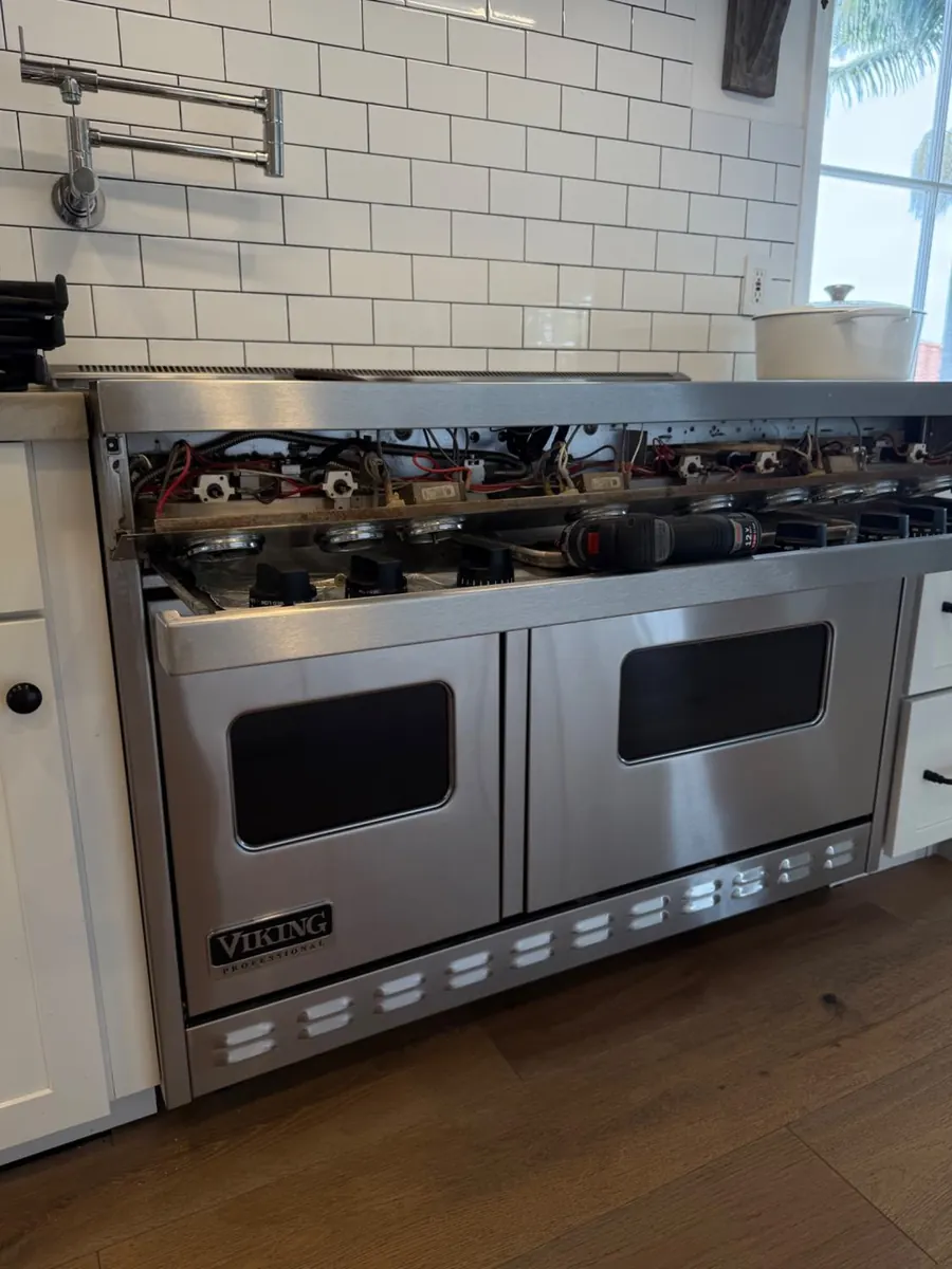 Viking professional range with the top opened during a diagnostic visit